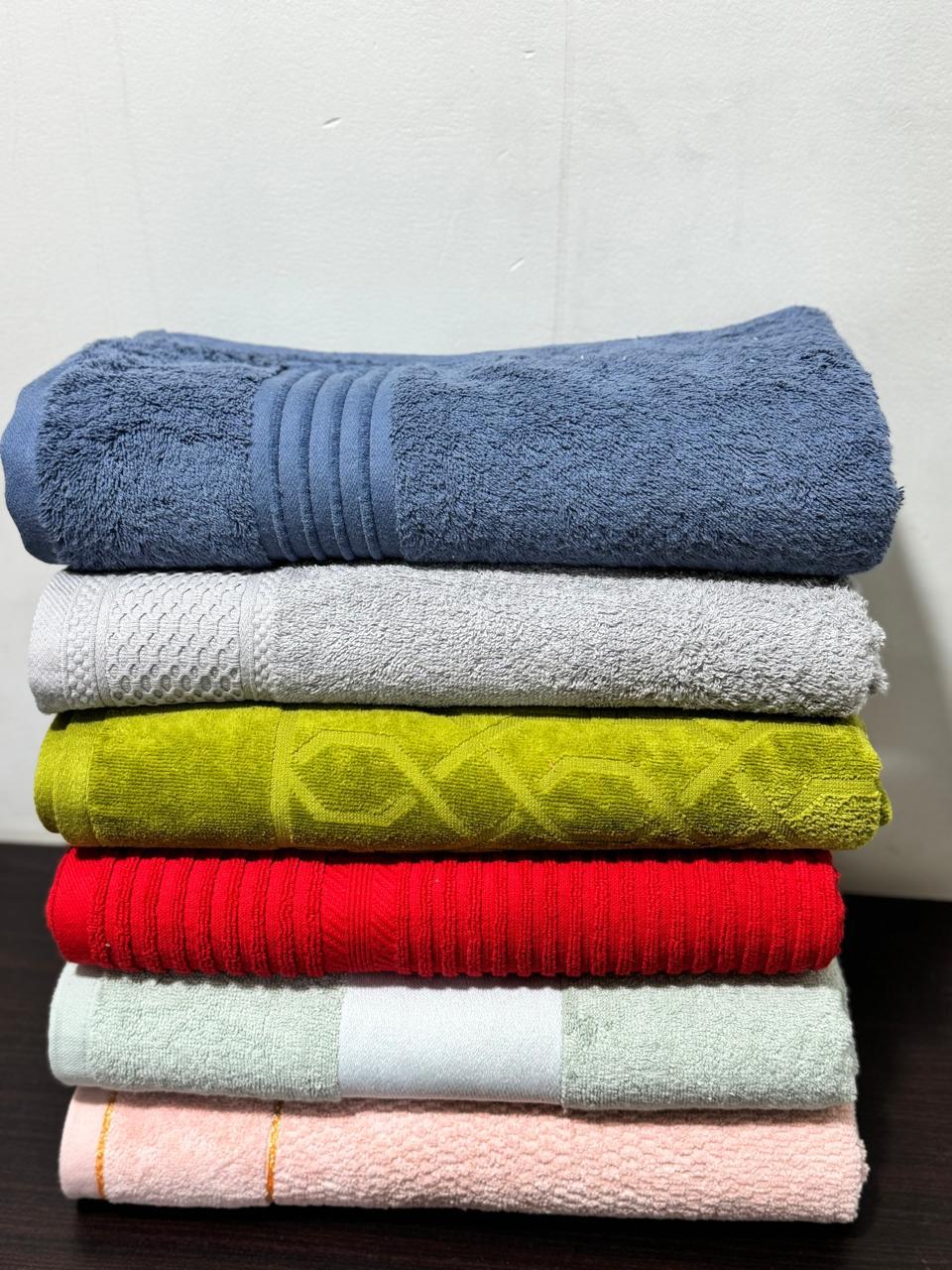 Real factory photo: folded stack of bulk wholesale towels